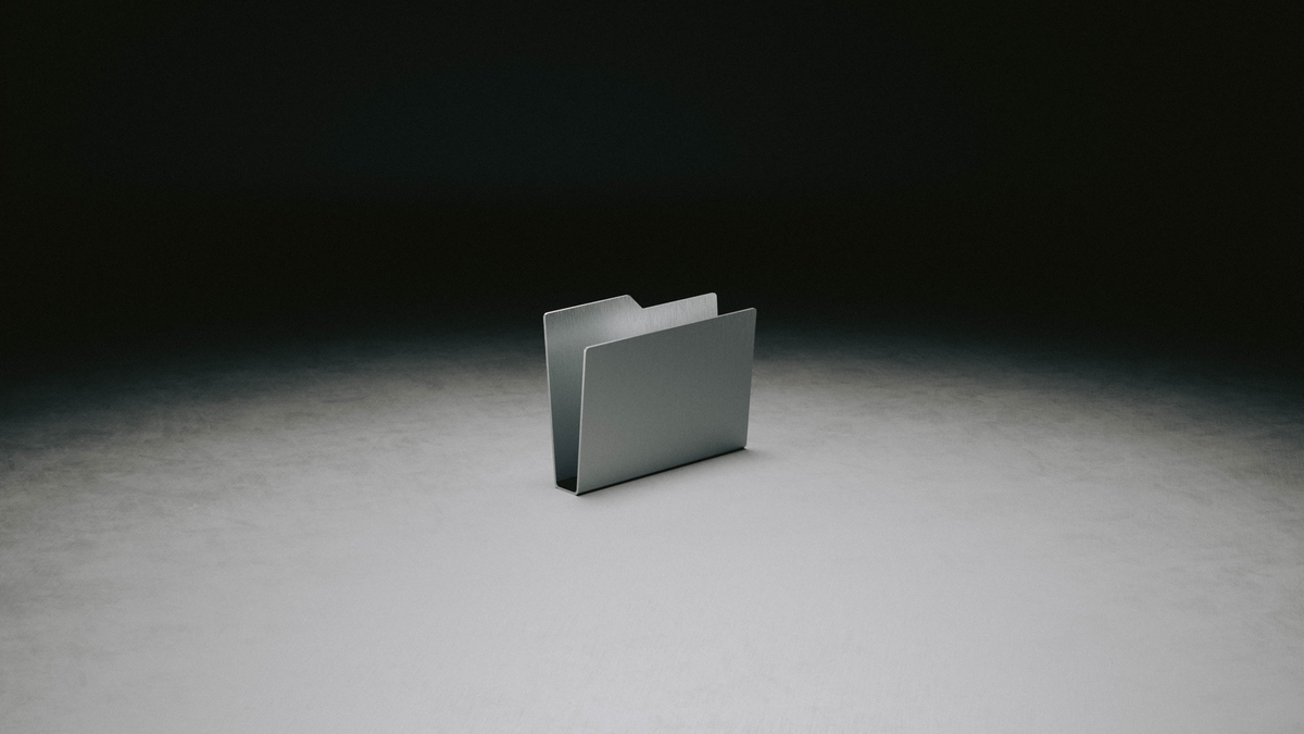 Desktop Folder in aluminum under a single spotlight