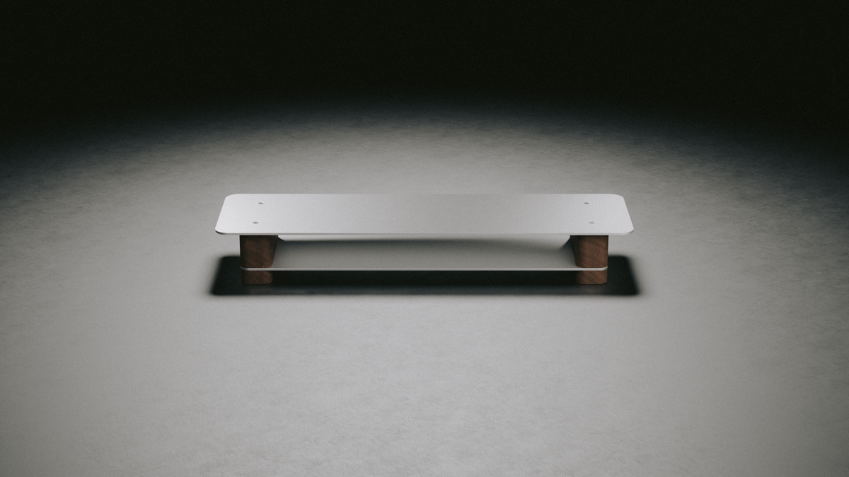 Industrial Monitor Stand, aluminum top on walnut legs, under a spotlight