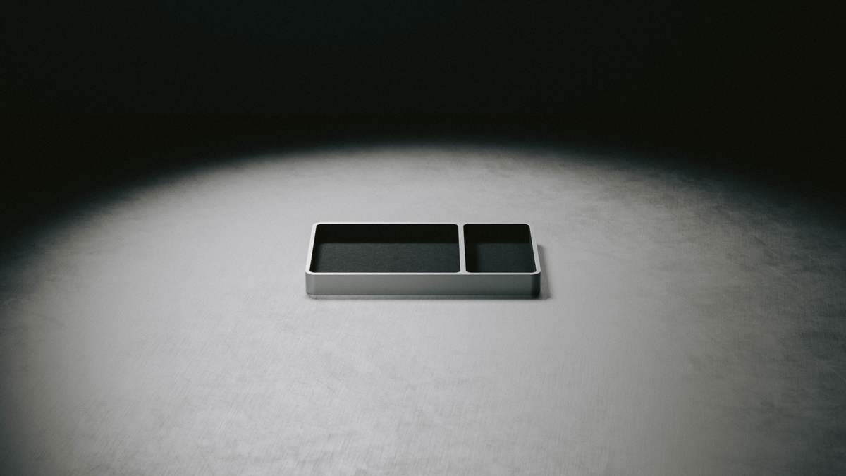 Valet Tray with black felt compartments under a single spotlight